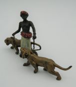 A cold painted bronze model of an Arab and tigers. 12.5 cm long.