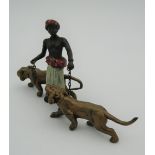 A cold painted bronze model of an Arab and tigers. 12.5 cm long.