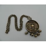 A Chinese pendant on chain. 4 cm diameter.