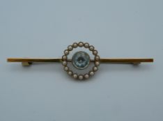 A 15 ct gold aquamarine and pearl bar brooch. 5.75 cm long (4.