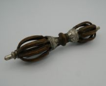 A Tibetan bronze vajra. 15 cm long.