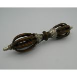 A Tibetan bronze vajra. 15 cm long.