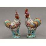 A pair of early 20th century Chinese porcelain figures of cockerels,