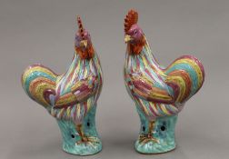 A pair of early 20th century Chinese porcelain figures of cockerels,