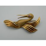 A 9 ct gold stork bird brooch with ruby eye. 4.5 cm wide (4.