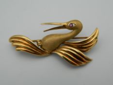 A 9 ct gold stork bird brooch with ruby eye. 4.5 cm wide (4.