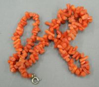 A coral necklace. 42 cm long.