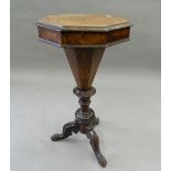 A Victorian burr walnut octagonal trumpet worktable. 43.5 cm wide.