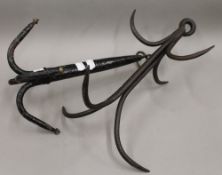 Two vintage meat hooks. The largest 38 cm high.