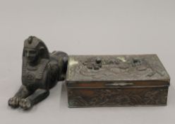 A model sphinx and a Chinese box. The former 17 cm long.