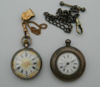 A silver engraved pocket watch (3 cm diameter) with yellow metal watch chain, etc.