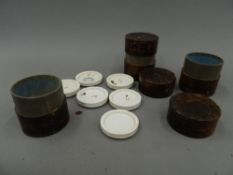 Three 19th century leather cases containing artists pallets. Each case 7.5 cm high.