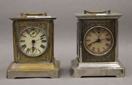 Two carriage alarm clocks. The largest 19 cm high.