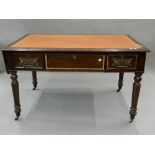 A Victorian walnut writing table. 125 cm wide.