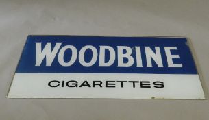 A vintage Woodbines Cigarette glass advertising sign. 92 cm wide.