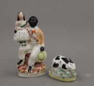 A 19th century Staffordshire figure of a black and white rabbit and a small 19th century