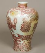 A Chinese porcelain Meiping vase, worked with dragons amongst stylised waves,