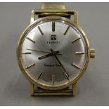 A vintage Tissot 9 ct gold Seastar Seven watch, recently serviced. 3.5 cm wide.