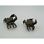 Two small Japanese bronze models of crabs. The largest 5 cm wide.