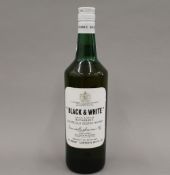 A single bottle of Black & White 70% Proof Whisky