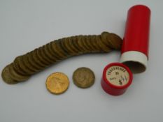 A tube of three pence pieces