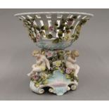 A 19th century Continental figural porcelain tazza. 30 cm high.