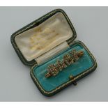A Victorian yellow metal and pearl 'baby' brooch. 3.5 cm wide (2.