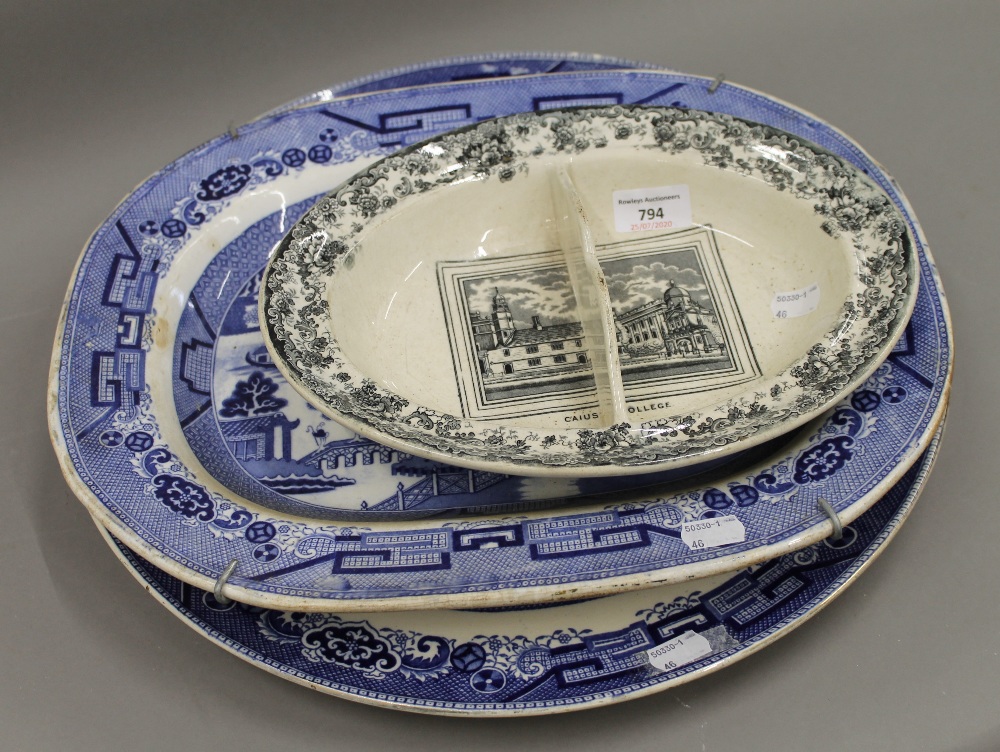 A Victorian Caius College sewing dish and two large Willow pattern plates. The former 30 cm wide.