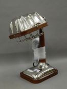 A leather and chrome desk lamp. 36 cm high.