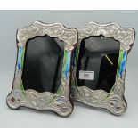 A pair of Art Nouveau style sterling silver photo frames. 21 cm high.