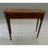 A 19th century inlaid mahogany tea table. 89.5 cm wide.