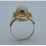 An unmarked gold and opal ring. Ring size M/N.