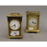 Two carriage clocks. The largest 12 cm high.