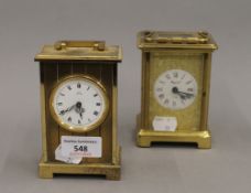 Two carriage clocks. The largest 12 cm high.