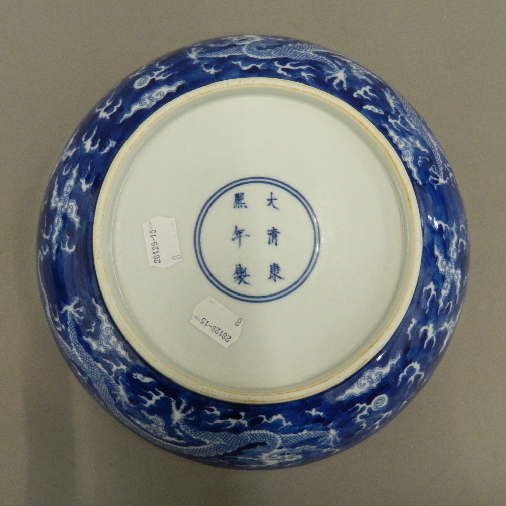 A Chinese blue and white porcelain dish, decorated with dragons chasing flaming pearls, - Image 2 of 3