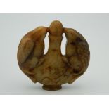 A Chinese toffee jade roundel. 5.5 cm wide.