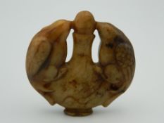 A Chinese toffee jade roundel. 5.5 cm wide.