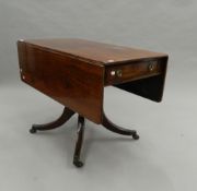 A Victorian mahogany pedestal Pembroke table. 100 cm deep.