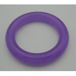 A lavender jade bangle. 8.5 cm diameter.