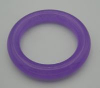 A lavender jade bangle. 8.5 cm diameter.