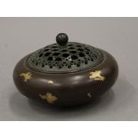 A Chinese gold splash bronze censer. 11.5 cm diameter.