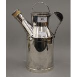 A silver plated Reed and Barton cocktail shaker in the form of an oil can. 27 cm high.