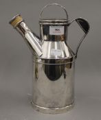 A silver plated Reed and Barton cocktail shaker in the form of an oil can. 27 cm high.