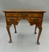 A 19th century walnut lowboy. 75.5 cm wide.