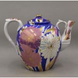 A large decorative gilt heightened porcelain tea pot. 24 cm high.