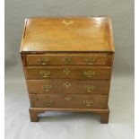 A George III mahogany bureau with well. 75.5 cm wide.