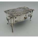 A hallmarked silver jewellery box in the form of a table,