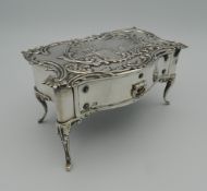 A hallmarked silver jewellery box in the form of a table,