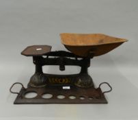 A set of Victorian cast iron shop scales. 49 cm wide.