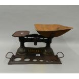 A set of Victorian cast iron shop scales. 49 cm wide.